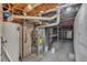 Basement with water heater, furnace, and storage or workshop space at 7760 Magnolia St, Commerce City, CO 80022