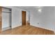 Spacious bedroom with hardwood floors and a closet with ample storage space at 7760 Magnolia St, Commerce City, CO 80022