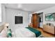 Bright bedroom with a modern blackboard and a walk-in closet at 7760 Magnolia St, Commerce City, CO 80022