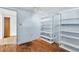 Flex room with bright walls and built-in shelving for storage at 7760 Magnolia St, Commerce City, CO 80022