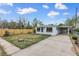 Charming single-story home with a well-maintained front yard, a carport and a newly constructed wooden fence at 7760 Magnolia St, Commerce City, CO 80022