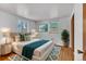Nicely staged main bedroom featuring hardwood floors, neutral colors, and modern décor at 7760 Magnolia St, Commerce City, CO 80022
