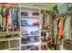 Organized closet with shelves, hanging rods, and storage baskets providing ample space for clothing and accessories at 11932 W Long Cir # 202, Littleton, CO 80127