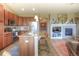 Stylish kitchen featuring a center island, stainless steel appliances, and an open layout connecting to the living room at 11932 W Long Cir # 202, Littleton, CO 80127