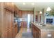 Modern kitchen featuring a large island, stainless steel appliances, and ample cabinet space at 11932 W Long Cir # 202, Littleton, CO 80127