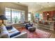 Inviting living space with a large window, open to the kitchen and dining area, creating a seamless flow at 11932 W Long Cir # 202, Littleton, CO 80127