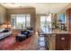 Comfortable living room and island featuring a large window, cozy seating, and a bar-height countertop at 11932 W Long Cir # 202, Littleton, CO 80127