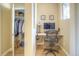 Home office with built-in desk and closet, providing functional storage and workspace solutions at 11932 W Long Cir # 202, Littleton, CO 80127