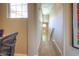 Bright staircase with light wood treads and white risers, illuminated by ample natural light at 11932 W Long Cir # 202, Littleton, CO 80127