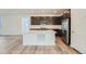 Modern kitchen with stainless steel appliances, dark cabinets, and a large center island at 3172 S Russell St, Morrison, CO 80465