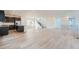 Bright and open living space with light wood floors, recessed lighting, and a modern staircase at 3172 S Russell St, Morrison, CO 80465