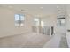 Bright and airy loft area with neutral carpet, windows, and view of the surrounding neighborhood at 3172 S Russell St, Morrison, CO 80465