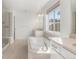 Spa-like bathroom with soaking tub and walk-in shower at 3589 Rucksack Ct, Castle Rock, CO 80108