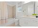 Clean bathroom with a white vanity and beige tile at 3589 Rucksack Ct, Castle Rock, CO 80108