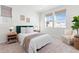 Cozy bedroom with a teal headboard and plenty of natural light at 3589 Rucksack Ct, Castle Rock, CO 80108