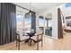 Dining area with glass top table and four chairs near sliding doors at 3589 Rucksack Ct, Castle Rock, CO 80108