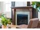 Modern fireplace with a light green tile surround at 3589 Rucksack Ct, Castle Rock, CO 80108