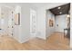 Light and airy hallway with light wood flooring and access to other rooms at 3589 Rucksack Ct, Castle Rock, CO 80108