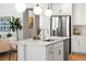 Kitchen island with white quartz countertop and modern sink faucet at 3589 Rucksack Ct, Castle Rock, CO 80108