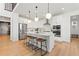 Open concept kitchen featuring island with seating and stainless steel appliances at 3589 Rucksack Ct, Castle Rock, CO 80108