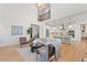 Open living room with high ceilings and view into kitchen at 3589 Rucksack Ct, Castle Rock, CO 80108