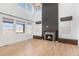 Bright living room with hardwood floors and a fireplace at 3589 Rucksack Ct, Castle Rock, CO 80108