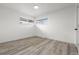 Empty bedroom with neutral walls, modern flooring, and a bright window at 3311 Jasmine St, Denver, CO 80207