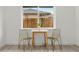 Cozy dining area with a small table, chairs, and a view to the back yard at 3311 Jasmine St, Denver, CO 80207