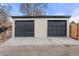 A detached two car garage with a concrete driveway at 3311 Jasmine St, Denver, CO 80207