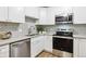 Modern kitchen featuring updated appliances and cabinetry at 765 S Alton Way # 4A, Denver, CO 80247