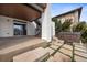 Backyard patio featuring a hot tub, a covered deck, stairs, and a stepping stone path at 10468 Ladera Dr, Lone Tree, CO 80124