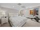 Bright bedroom with a comfortable white bed, ample natural light, and a modern exercise bike at 10468 Ladera Dr, Lone Tree, CO 80124