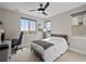 Comfortable bedroom with lots of natural light, an adjacent desk and stunning views at 10468 Ladera Dr, Lone Tree, CO 80124
