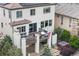 Exterior view of a multi-story home with a deck, hot tub, and well-maintained landscaping at 10468 Ladera Dr, Lone Tree, CO 80124