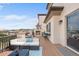 Enjoy rooftop views and a cozy fireplace on this deck with ample seating and outdoor bar at 10468 Ladera Dr, Lone Tree, CO 80124