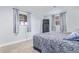 Bedroom with blue patterned bedding, blue curtains, and a mounted TV at 1081 E 119Th Pl, Northglenn, CO 80233