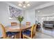 Cozy dining room with hardwood table, four chairs, and natural light at 1081 E 119Th Pl, Northglenn, CO 80233