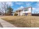 Charming brick home featuring a covered porch, attached garage, and well-maintained front yard at 1081 E 119Th Pl, Northglenn, CO 80233