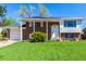 Charming two-story home with a brick facade, manicured lawn, and inviting front porch at 1081 E 119Th Pl, Northglenn, CO 80233