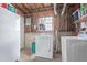 Unfinished laundry room with a washer, dryer, and utility sink at 1081 E 119Th Pl, Northglenn, CO 80233