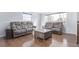 Spacious living room with hardwood floors and comfortable seating at 1081 E 119Th Pl, Northglenn, CO 80233