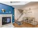 An open concept living area features a fireplace and flows to the dining room at 546 Lost Valley Pt, Castle Rock, CO 80108