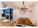 Dining room with a modern chandelier, hardwood floors, and a cozy fireplace at 546 Lost Valley Pt, Castle Rock, CO 80108