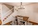 A well-lit dining room with a wooden table and chandelier, perfect for Gathering dinners at 546 Lost Valley Pt, Castle Rock, CO 80108