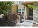 Home exterior with a covered porch area, stone pillars and patio at 546 Lost Valley Pt, Castle Rock, CO 80108