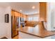 Updated kitchen with stainless steel appliances, granite countertops, and bright natural light and well organized layout at 546 Lost Valley Pt, Castle Rock, CO 80108