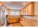 The kitchen has stainless steel appliances, granite countertops, and ample cabinet space at 546 Lost Valley Pt, Castle Rock, CO 80108