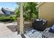 Cozy patio with a grill, neutral colored patterned rug, and an outdoor seating area at 546 Lost Valley Pt, Castle Rock, CO 80108