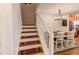 A staircase leads up to the second floor near the dining room and kitchen at 546 Lost Valley Pt, Castle Rock, CO 80108