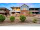 View of back exterior with two-story deck and a wooden fence surrounding the yard at 12575 Sandstone Dr, Broomfield, CO 80021